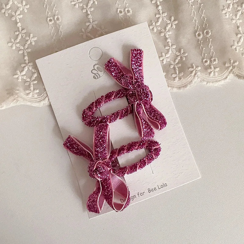 Set of two glitter hair accessories for kids, easy to clip into little girls' hair.