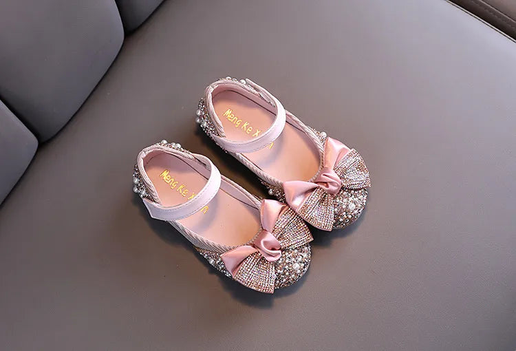 Girls' pink rhinestone bow flats, comfortable and chic for any special event or party