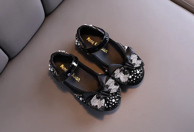 Girls' comfortable yet stylish pink party flats, adorned with a lovely rhinestone bow