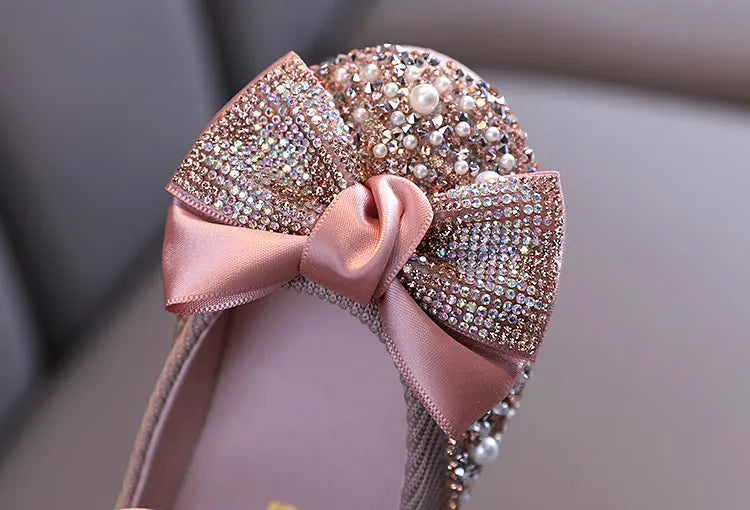 Girls' pink special occasion flats with rhinestone bow, ensuring elegance and comfort for kids