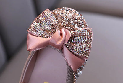 Girls' pink special occasion flats with rhinestone bow, ensuring elegance and comfort for kids
