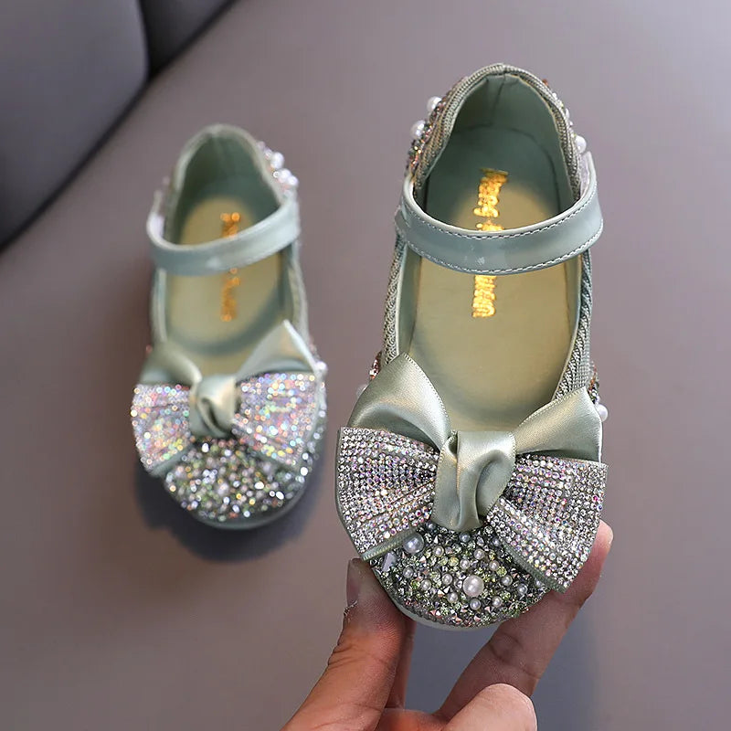 Side view of girls' pink princess party flats showing comfortable design and rhinestone bow