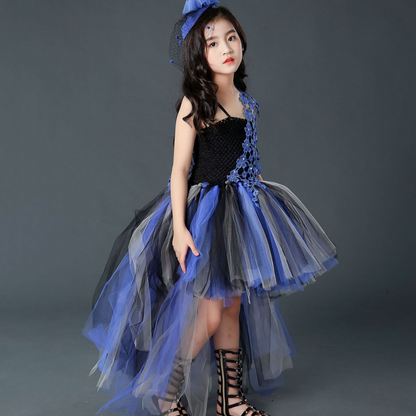 Full shot of a girls' Halloween costume: a black and purple trailing tutu dress with a voluminous skirt