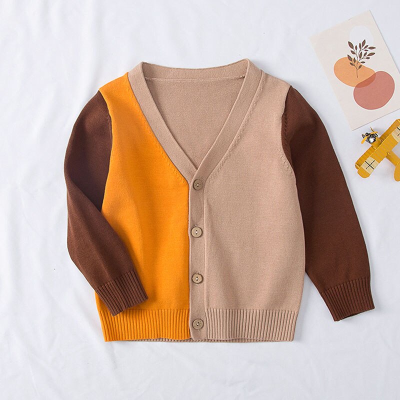 Girls' outerwear: a pink knitted cardigan sweater featuring an adorable pear fruit pattern and button closure.