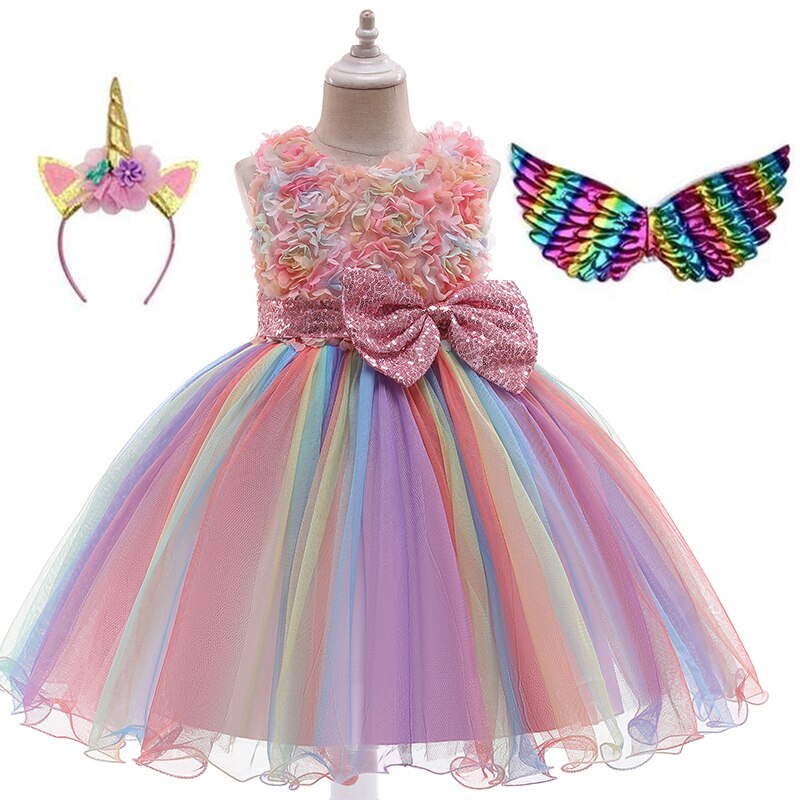 Side profile of a girl in a sparkling unicorn costume dress, featuring a voluminous skirt and attached wings.