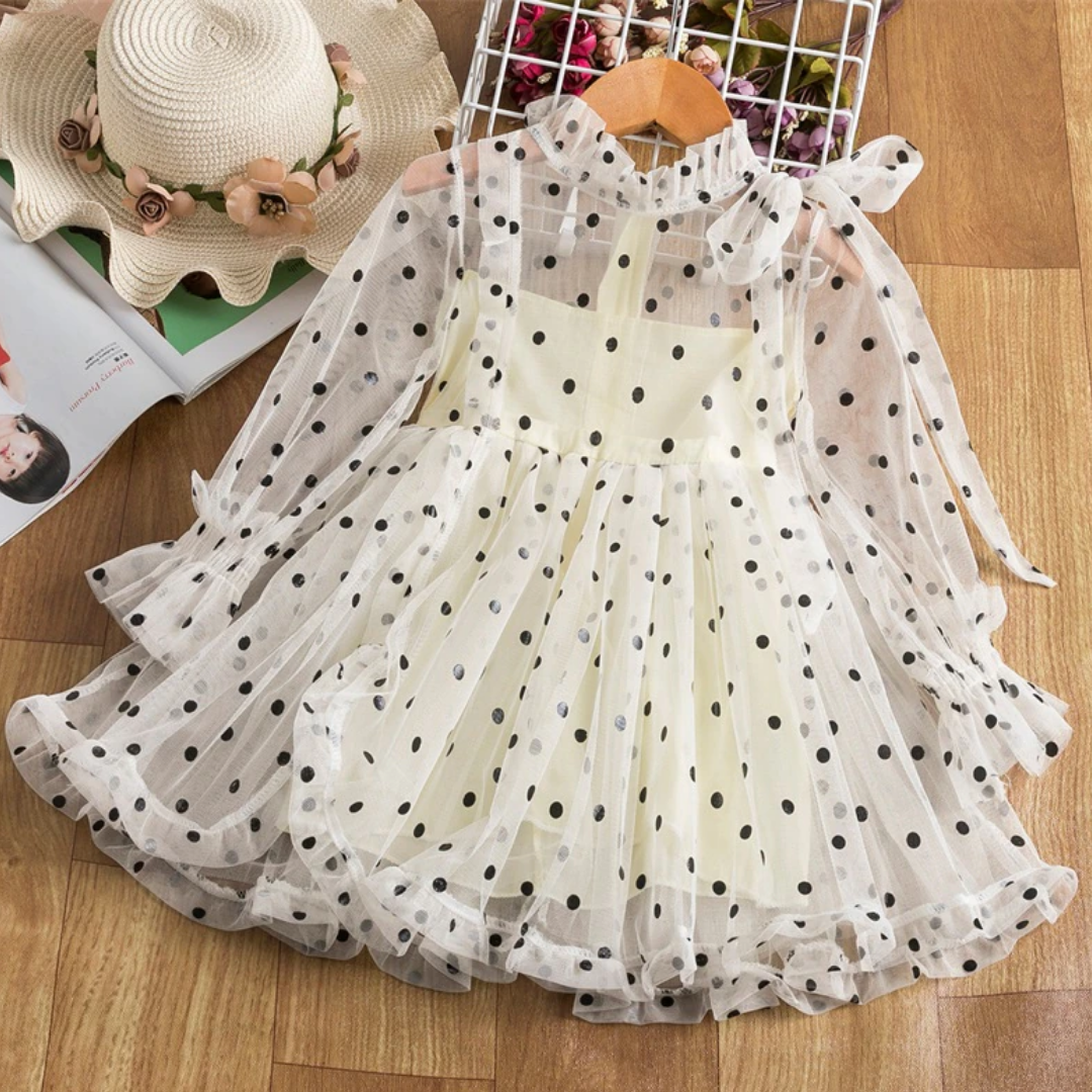 Back view of a baby girl's long sleeve dotted mesh ruffle dress, comfortable and chic party dress