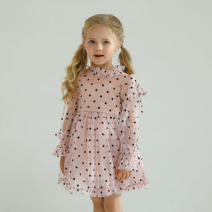Baby girl in a charming long sleeve dotted mesh ruffled dress, ideal for parties.