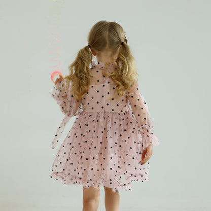Back view of long sleeve dotted mesh ruffled dress for girls, with keyhole detail.