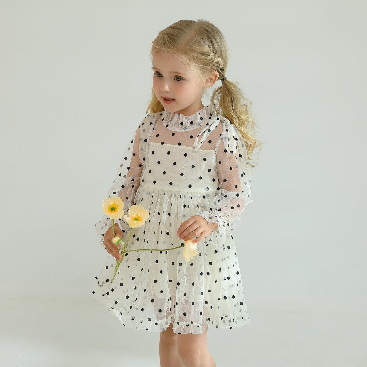 Comfortable baby clothing: Girls' long sleeve dotted mesh ruffled dress in soft fabric.