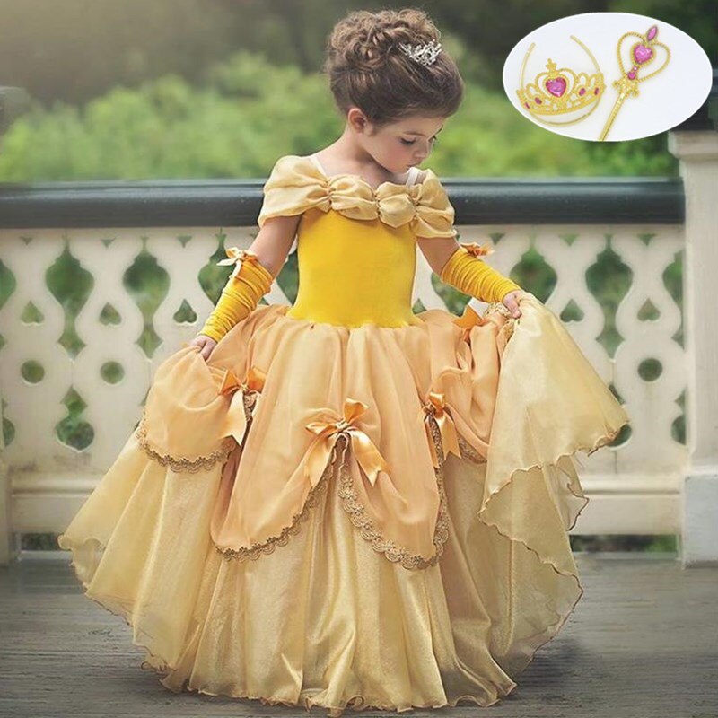 Child beaming in a whimsical unicorn princess dress, featuring a horn headband and delicate wings