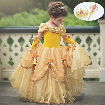 Child beaming in a whimsical unicorn princess dress, featuring a horn headband and delicate wings