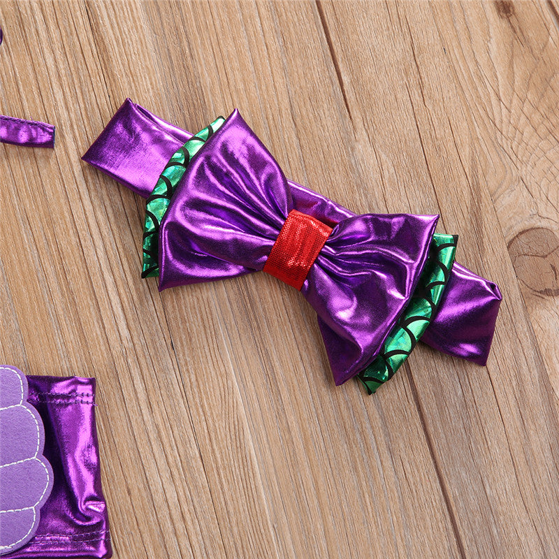 Adorable girls' mermaid swimsuit set displayed flat, highlighting the vibrant colors & design