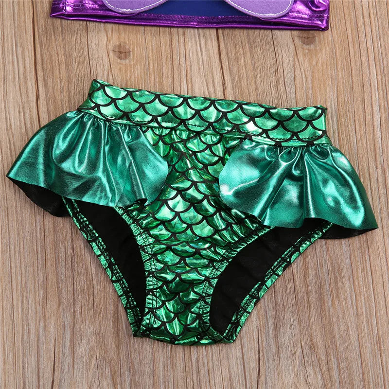 Three-piece baby swimwear set: mermaid scale halter top, high-waisted bottoms, and cute headband