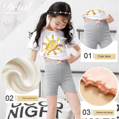 Soft modal girls' shorts with a delicate bow, perfect safety underpants