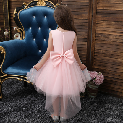 Close-up of a toddler girl's ombre floral dress with delicate pearl details, princess style