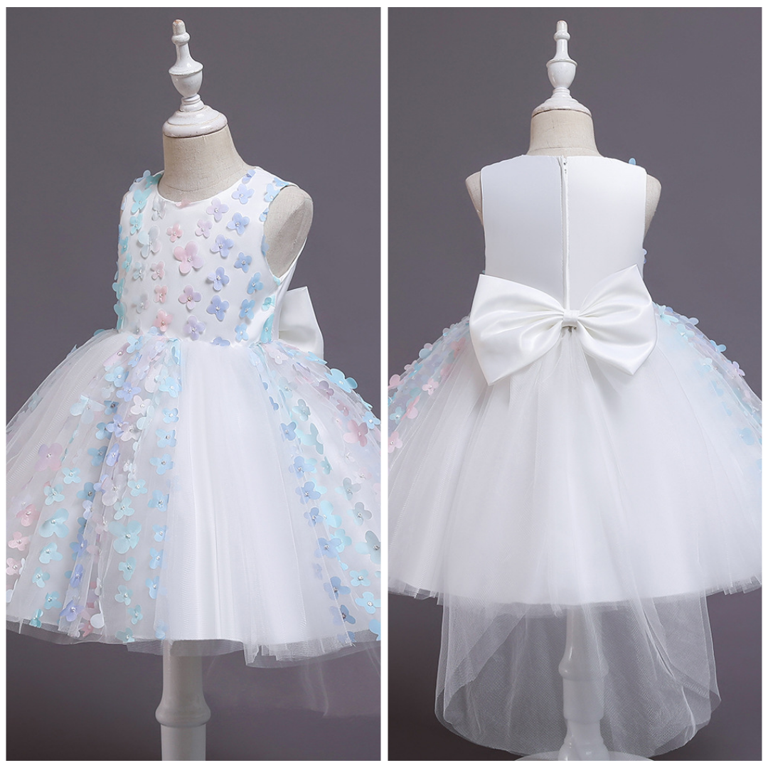 Full shot of a girls' pink and purple ombre floral special occasion ball gown with pearls