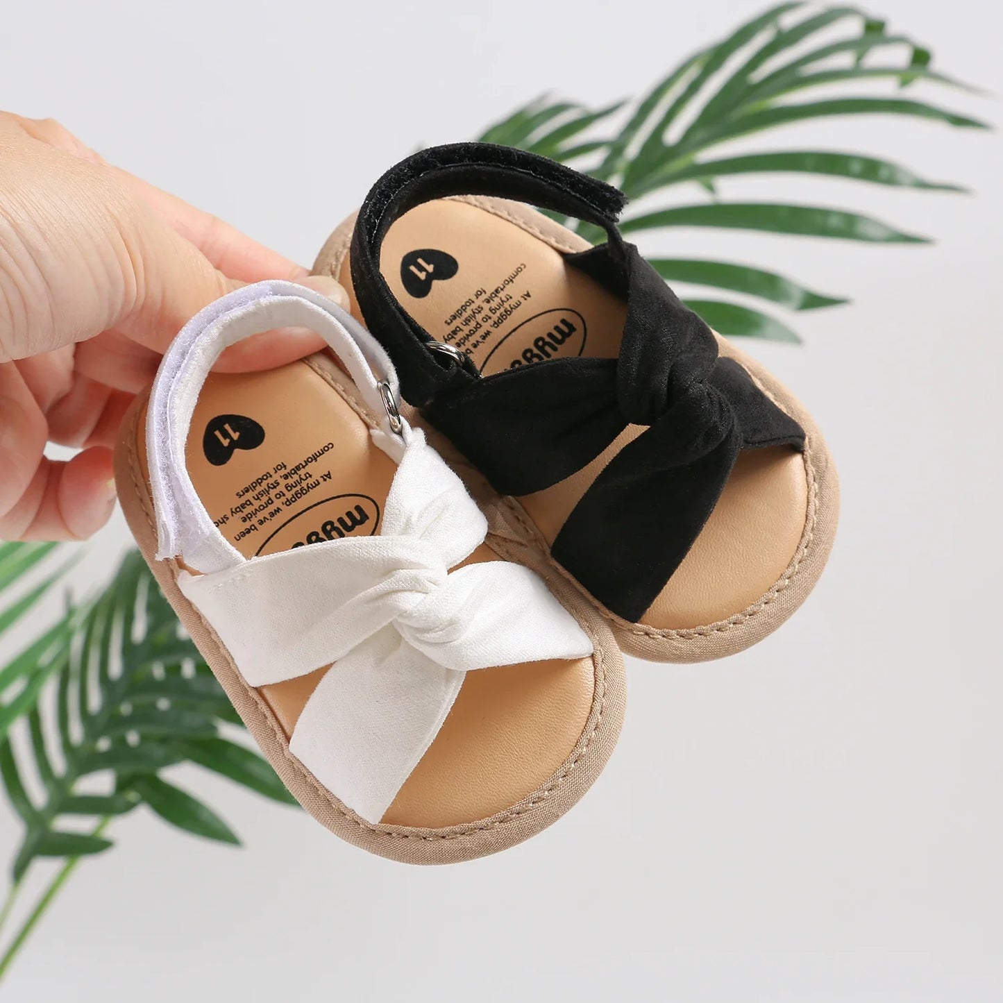 Top-down view of pink bow-knot toddler sandals, ideal first walkers with non-slip sole