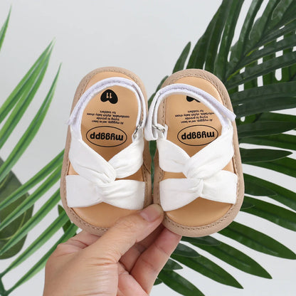 Infant girl's pink bow-knot sandals for toddlers, featuring a flexible non-slip sole