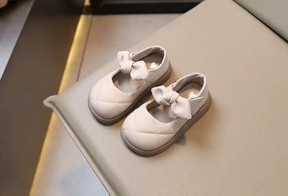 Front view of pink bowknot Mary Janes, soft PU leather with elegant design for girls