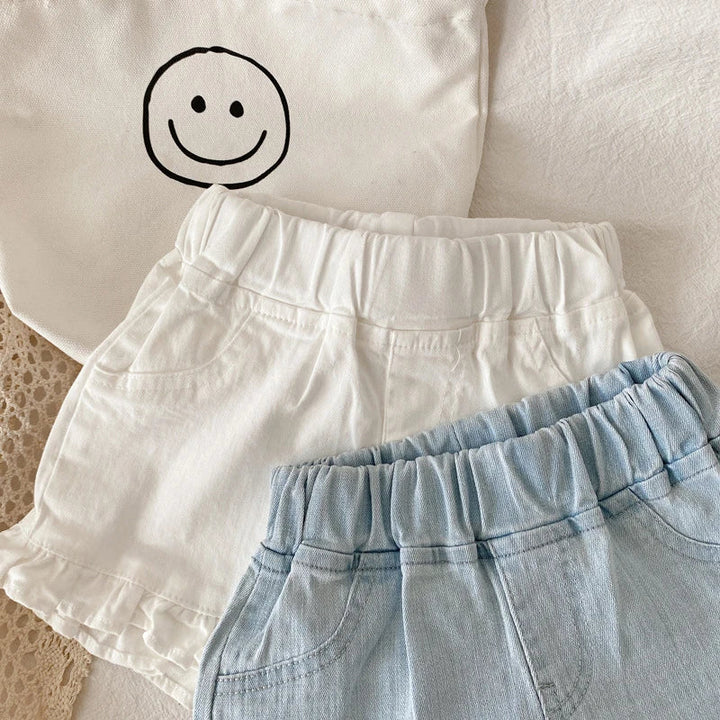 Blue cotton ruffle shorts for kids, designed for durability and comfort during play.