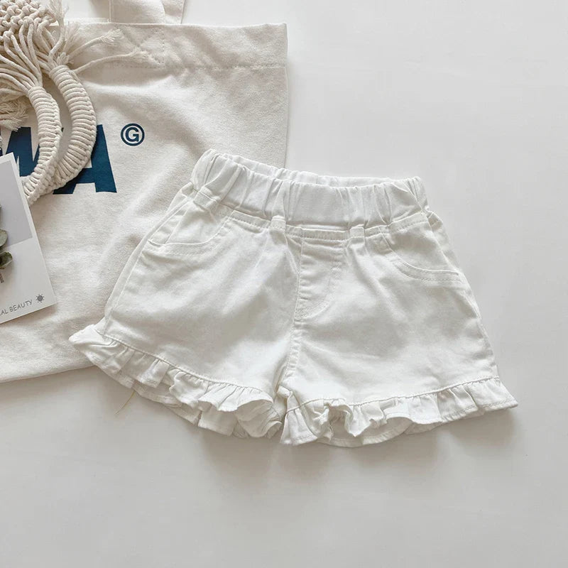 Yellow cotton ruffle shorts for infant girls, featuring a cute design and comfortable fit.