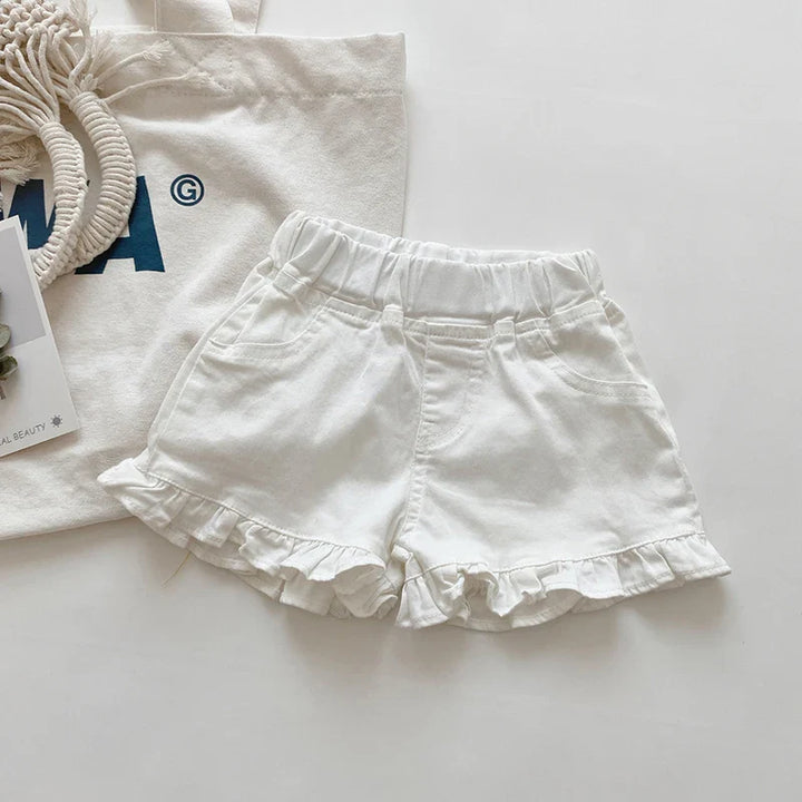 Yellow cotton ruffle shorts for infant girls, featuring a cute design and comfortable fit.