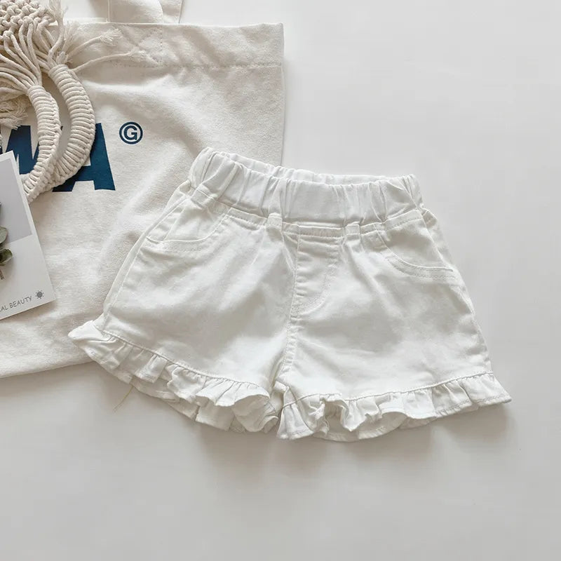 Side view of girls' cotton ruffle shorts, showing the layered ruffle detail clearly.