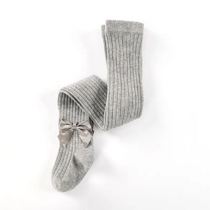 Close-up of the cotton fabric texture on girls' bow socks, high quality and soft for baby feet