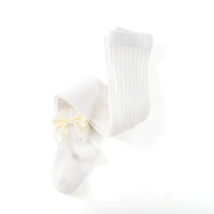 A pair of white girls' cotton socks with a matching bow, versatile and cute for any outfit