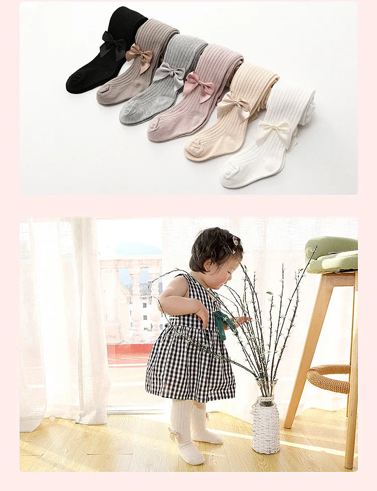 Multiple pairs of girls' cotton socks with various bow designs, stylish and functional baby wear