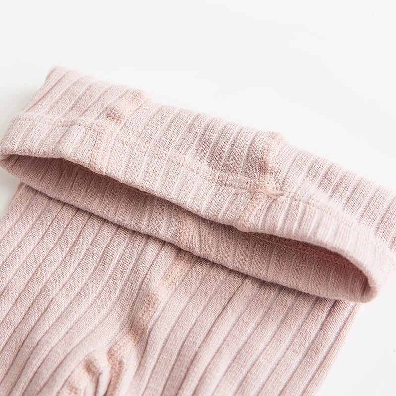 Girls' cotton socks in soft pink with a delicate bow, ideal for baby and toddler everyday wear