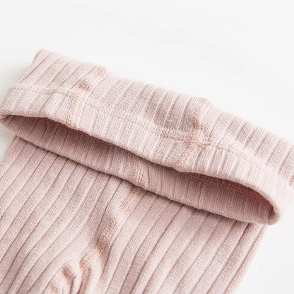 Girls' cotton socks in soft pink with a delicate bow, ideal for baby and toddler everyday wear