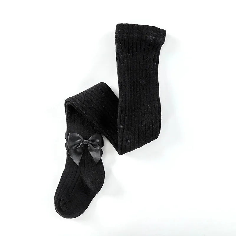 Set of different colored girls' bow cotton socks displayed neatly, essential baby accessories