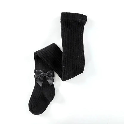 Set of different colored girls' bow cotton socks displayed neatly, essential baby accessories