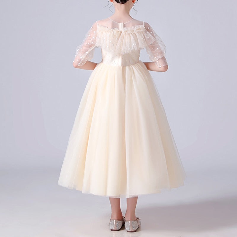 Kids formal wear: elegant girls' ball gown with dotted tulle, ruffles, and sequin accents