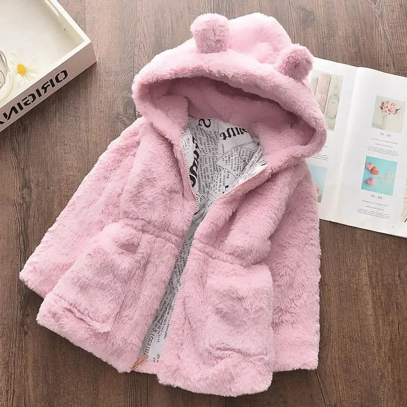 Adorable girls' pink winter coat, featuring a luxurious faux fur hood