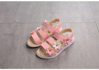 Cute girls' flat gladiator sandals with a delicate floral pattern and secure fit