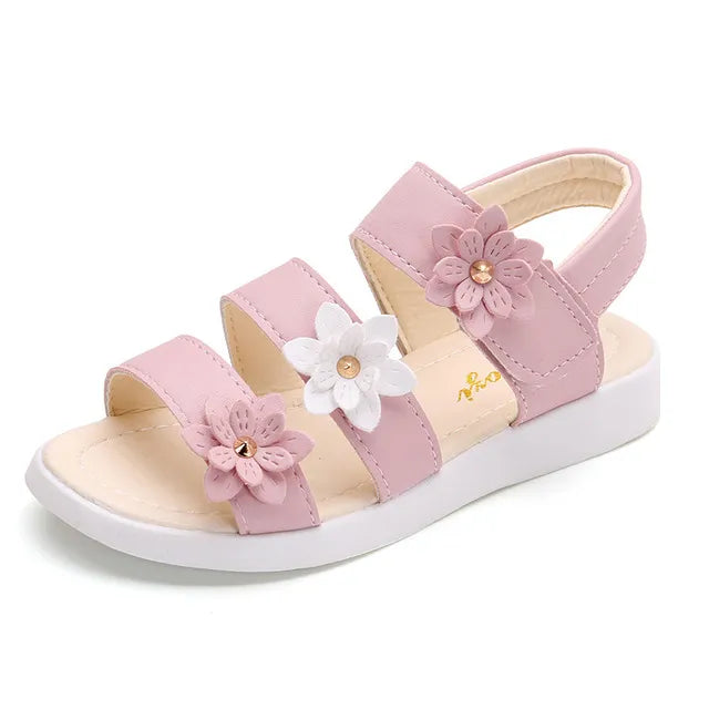 Side profile of a child's floral flat gladiator sandal, perfect for warm weather