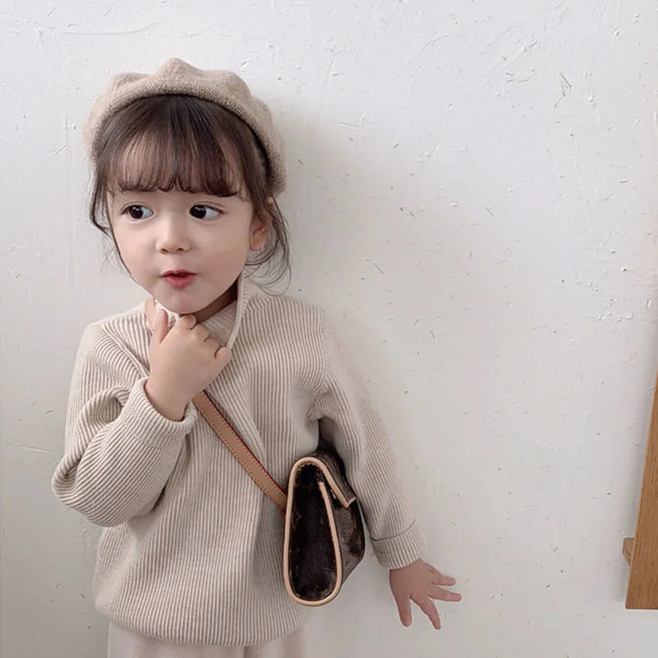 Girls' knitted turtleneck sweater in a beautiful burgundy, a fashionable toddler winter apparel choice