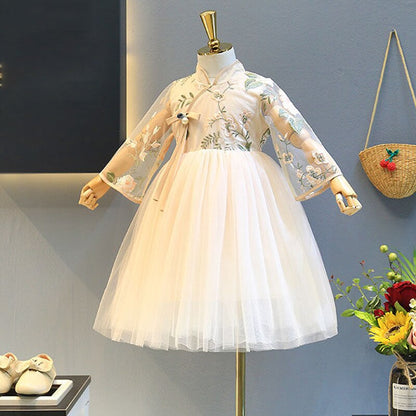 Front view of a vibrant yellow girls' princess dress featuring layered lace and puff sleeves.