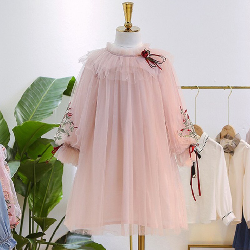 Little girl wearing a blue layered lace ruffle puff sleeve dress, suitable for toddler fashion.