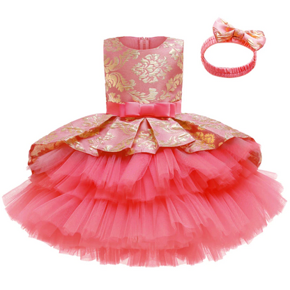 Close-up of a layered pink tutu dress fabric with an elegant matching headband for kids.