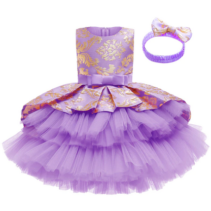 Girls' formal layered tutu dress in a pastel color with a cute coordinating headband.