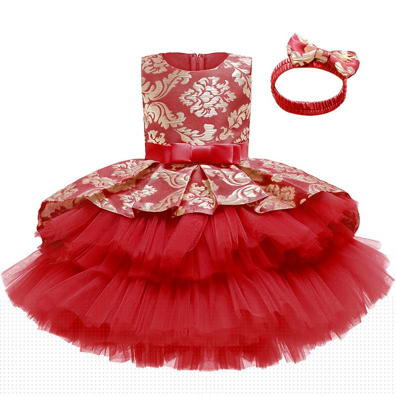 Model wearing a beautiful layered tutu dress & headband, suitable for special occasions.