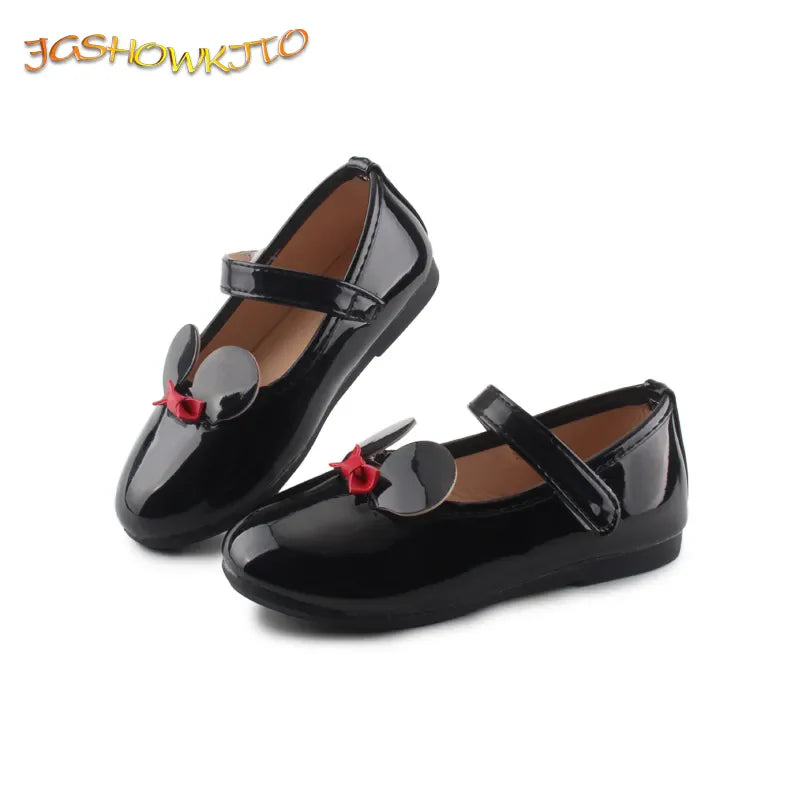 Side view of a girl's patent leather flat, showcasing the sleek design and anti-slip grip