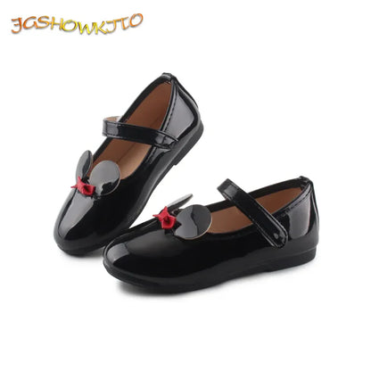 Side view of a girl's patent leather flat, showcasing the sleek design and anti-slip grip