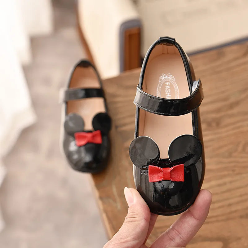Top view of comfortable girls' patent leather flats, ideal for toddlers with anti-slip feature