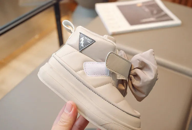 Girls' pink winter plush boots, fashionable and warm with a butterfly knot