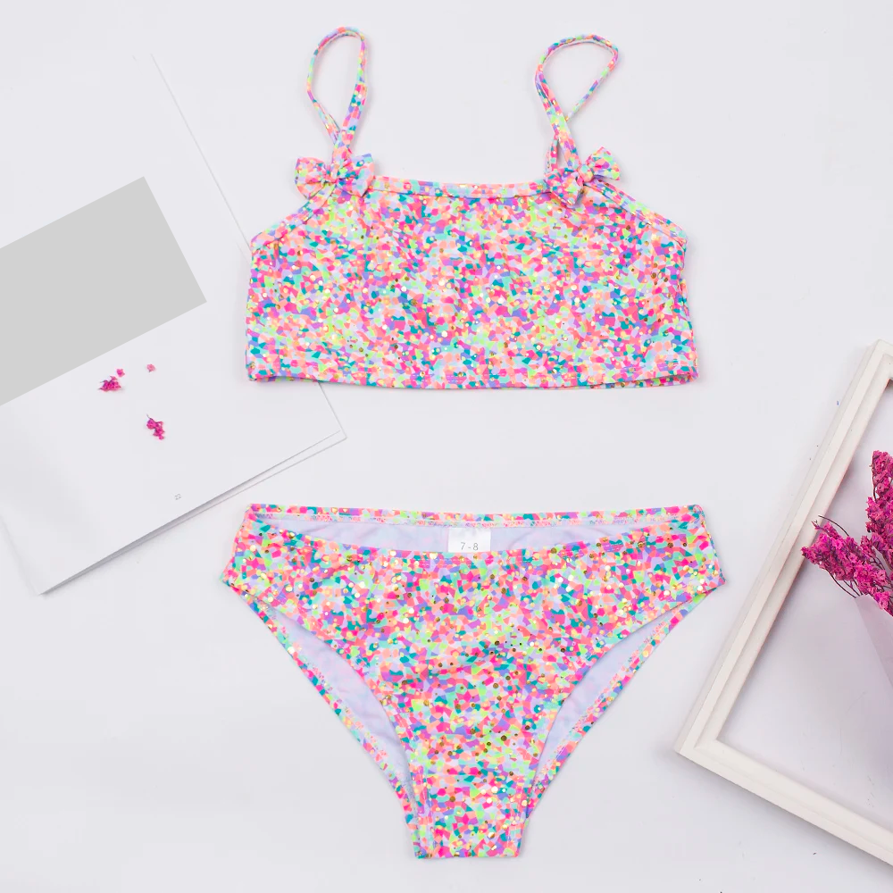 Girls' pink polka dot bikini set with bow accents, stylish and quick-dry swimwear for kids