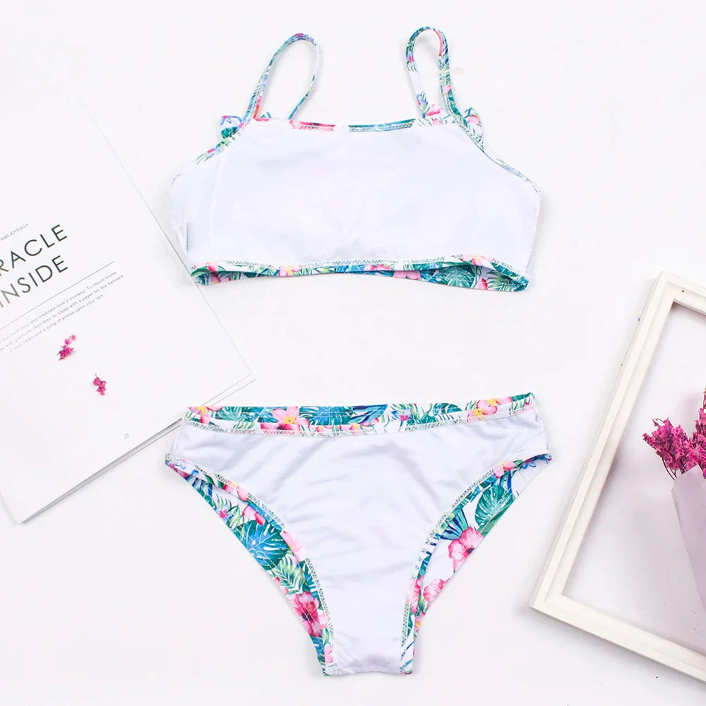 Up-close of the bow detail and print on girls' stylish and quick-dry bikini swimwear